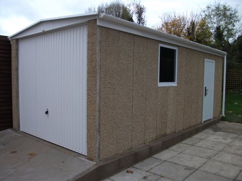 Fairford Concrete Garage on driveway with concrete slabs on the right